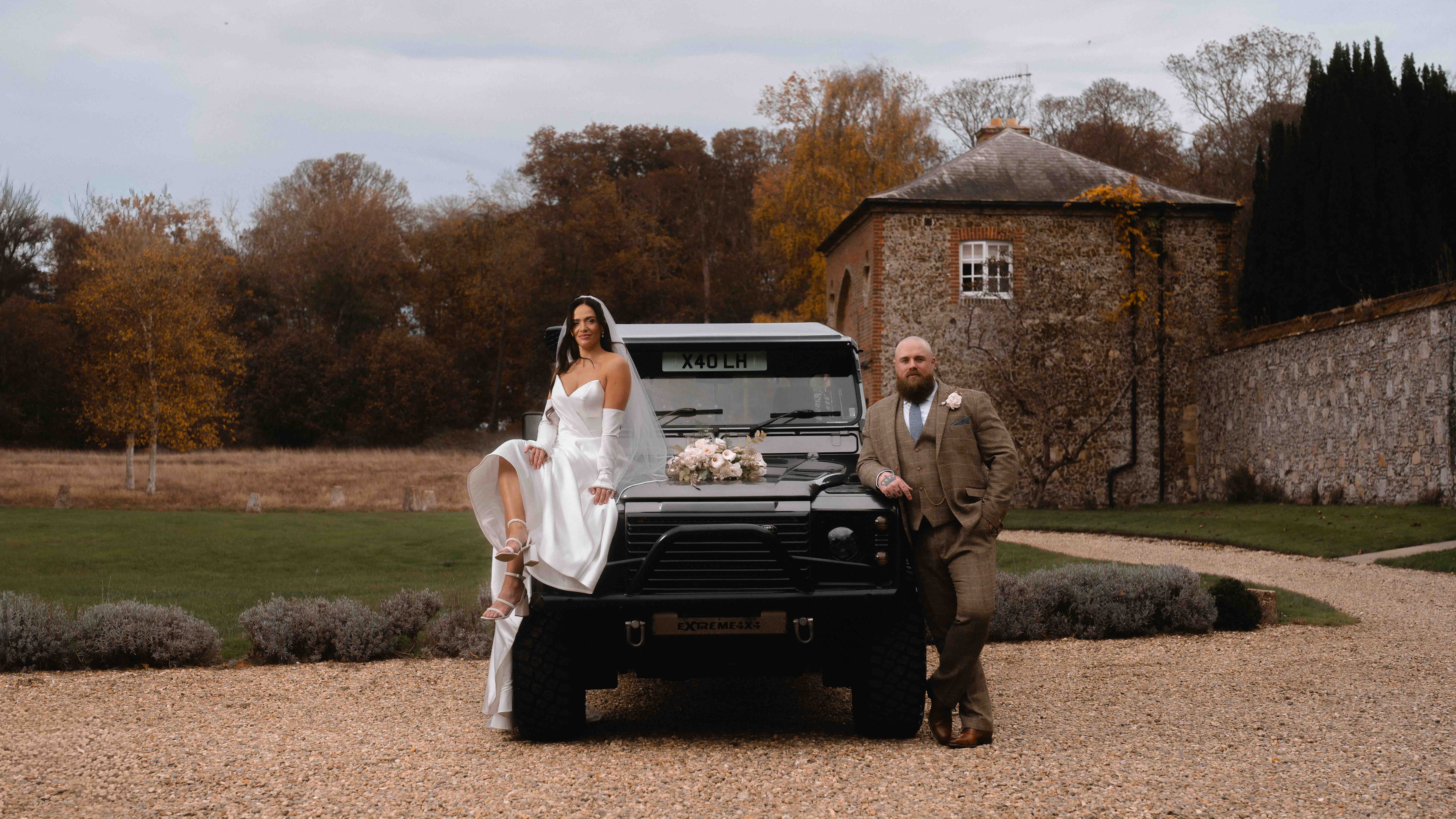 Wedding couple with Land Rover